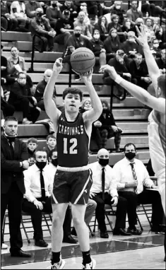  ??  ?? Above left, Mitchell Hays of New Bremen drives toward the basket during Friday’s regional final against Columbus Grove. Above right, Nick Alig lines up a shot for the Cardinals.