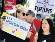  ?? Alan Berner Seattle Times ?? PROTESTERS rally outside a federal prison in SeaTac, Wash., where ICE says it sent detainees.