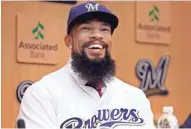  ?? RICK WOOD / MILWAUKEE JOURNAL SENTINEL ?? Eric Thames smiles Tuesday as he is introduced as the Brewers new first baseman. He played in Korea the last three seasons.