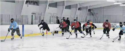  ?? RICHARD MACKENZIE ?? Members of the Pictou County Scotians junior B team doing a skating, warm-up drill during a recent practice at the Trenton Minor Sports Community Centre.