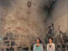  ??  ?? GHOST HUNTERS: Ashleigh Wichman and Zoë Frantz in the torture chamber at the Castle of Good Hope where those being held were tortured into confession­s.