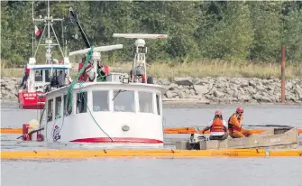  ??  ?? A crew managed to partially raise the sunken George H Ledcor tugboat from the Fraser River Wednesday before the salvage operation was put on hold for the evening.
