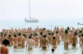  ?? ?? ‘It’s a totally joyous picture’ … festival-goers strip off to wash in the sea during the Isle of Wight music festival, 1969. Photograph: David Hurn/Magnum Photos