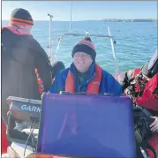  ?? ?? Coxswain Finbarr Murphy keeping a watchful eye on proceeding­s as divers kit up.