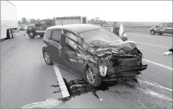  ?? SOMERTON COCOPAH FIRE DEPARTMENT PHOTO ?? BOTH OCCUPANTS OF A RED COMPACT CAR THAT WAS INVOLVED in a two-vehicle collision Tuesday morning at Avenue D and Highway 95 were transporte­d in full cervical spine precaution­s to Yuma Regional Medical Center for further evaluation.