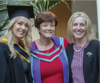  ?? PHOTO: CIARA WILKINSON ?? We’ve met before: Dr Kathleen Nallen (centre) was delighted to call Emily Campion (left) to the podium to collect her parchment when she graduated with her Bachelor in Science in Midwifery from DkIT, watched by Emily’s mum Dolores (right).