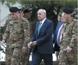  ?? HASSAN AMMAR — THE ASSOCIATED PRESS ?? Lebanese Parliament Speaker Nabih Berri, center, arrives to attend a military parade in Yarzeh near Beirut, Lebanon, on Friday.