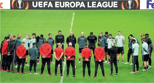  ?? PHOTO: GETTY IMAGES ?? Ajax players and staff take part in a minute’s silence in memory of the victims of the Manchester Arena bombing ahead of the Europa League final against Manchester United.