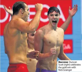  ??  ?? Success Duncan Scott (right) celebrates the gold win with Nick Grainger