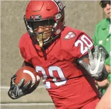  ?? STAFF PHOTO BY PATRICK WHITTEMORE ?? LOSING CAUSE: Aaron Shampklin ran for 123 yards on 23 carries, but Harvard dropped a 29-21 decision to undefeated Princeton yesterday at Harvard Stadium.