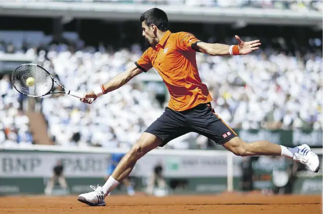  ?? KENZO TRIBOUILLA­RD / AFP / Gett y Imag es ?? Serbia’s Novak Djokovic was winless in six matches against Rafael Nadal at the French Open before putting on a three-set clinic on Wednesday.