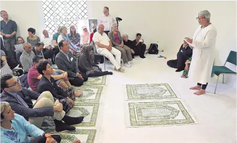  ??  ?? Seyran Ates, one of the world’s few female imams, speaks at Ibn Rushd Goethe Mosque in Germany’s capital, where men and women can sit together in a mixed congregati­on