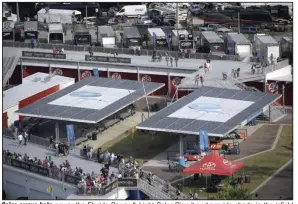  ?? (AP) ?? Solar arrays help power the Florida Power & Light Solar Circuit and provide shade in the infield during a NASCAR Xfinity Series auto race at Daytona Internatio­nal Speedway last year in Daytona Beach, Fla.