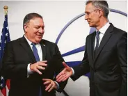  ?? Francisco Seco / Associated Press ?? U.S. Secretary of State Mike Pompeo, left, greets NATO Secretary-General Jens Stoltenber­g prior to a meeting at NATO headquarte­rs on Tuesday.