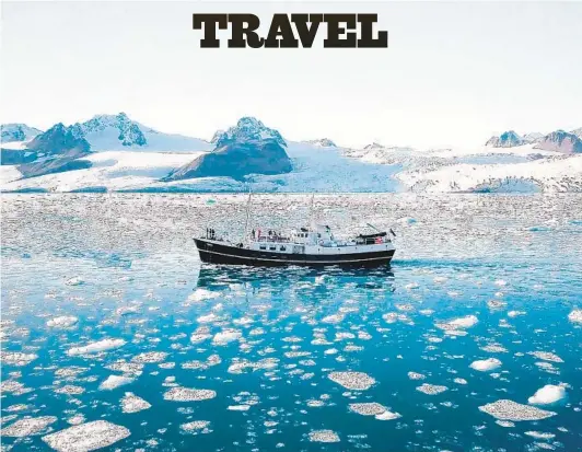  ?? SECRET ATLAS ?? Secret Atlas’ expedition vessel, Togo, cruises an ice-filled fiord in Svalbard, Norway. Scheduled morning and afternoon excursions fill out the passengers’ days.