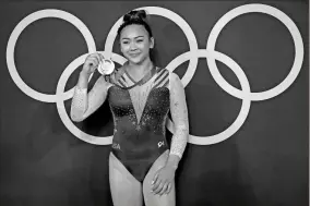  ?? Robert Deutsch-USA TODAY Sports ?? Sunisa Lee (USA) poses with her gold medal after winning the women’s gymnastics individual all-around final during the Tokyo 2020 Olympic Summer Games at Ariake Gymnastics Centre on Thursday in Tokyo.