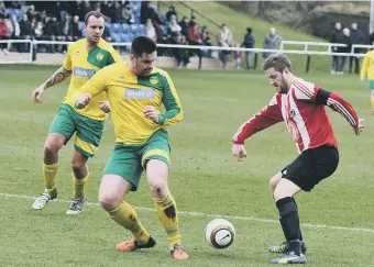  ??  ?? Sunderland West End (stripes) attack Leam Rangers in the recent Durham County Trophy final.