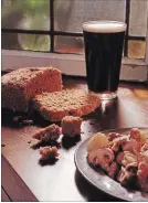  ?? SUSAN TUSA TNS ?? A glass of stout, bread and lamb stew. Guinness gives this stew its deep flavour.