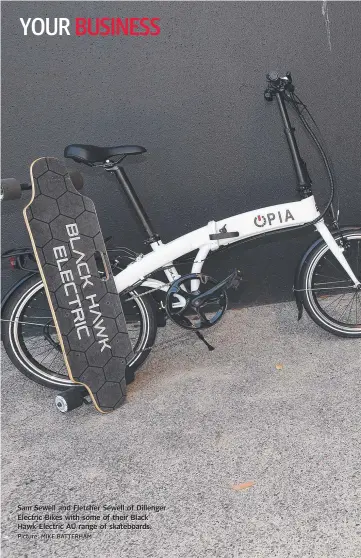  ?? Picture: MIKE BATTERHAM ?? Sam Sewell and Fletcher Sewell of Dillenger Electric Bikes with some of their Black Hawk Electric AU range of skateboard­s.