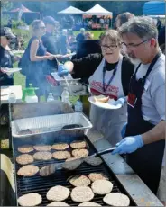  ?? Special to The Okanagan Weekend ?? Ronn Dunn of the North Okanagan Labour Council, was busy manning the grill at last year’s Labour Day picnic in Kelowna that drew an estimated 1,000 people.