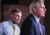  ?? ANNA MONEYMAKER Getty Images ?? U.S. Rep. Jim Jordan of Ohio, left, listens as House Minority Leader Kevin McCarthy says Republican­s might boycott the committee investigat­ing the January 6th riots after Speaker Nancy Pelosi rejected two selections.