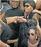  ?? Picture: DAYLIN PAUL ?? RITES: Nosiviwe MapisaNqak­ula at the funeral service of her son Chumani Nqakula last year. Also in the picture, front right, is Michelle Wege