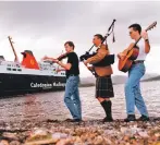  ??  ?? Fiddler David Boag, piper Alasdair Fraser and guitarist Michael Simpson of Feis Rois prepare to launch the Crossings Festival – a series of performanc­es organised by various artists on board Caledonian MacBrayne ferries throughout the Highlands and...