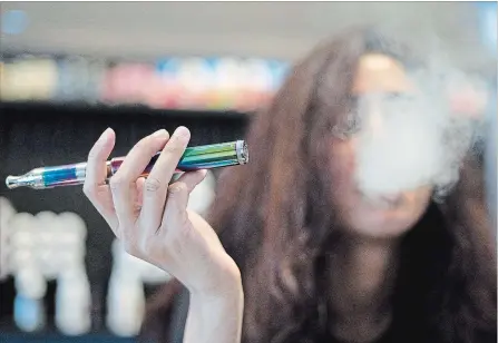  ?? JENNIFER GAUTHIER/METROLAND FILE PHOTO ?? A Vancouver shopkeeper demonstrat­es how to use a pen vape. Peterborou­gh Public Health is concerned about the rise in the use of vapour devices.