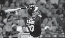  ?? AP/DAVID J. PHILLIP ?? Oakland Athletics’ Mark Canha watches his two-run single Thursday during the eighth inning against the Houston Astros in Houston.