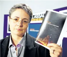  ?? VERONICA HENRI/POSTMEDIA NETWORK ?? Simona Jellinek, a lawyer with Jellinek Law Office and member of the Sexual Assault Advisory Committee holds up a guidebook for sexual assault survivors. It was launched to recognize Sexual Assault Awareness Month in 2011.