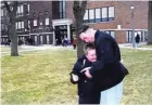  ?? COURTESY CYNTHIA TELFORD ?? Jeremy Cunningham, who died at the Milwaukee Secure Detention Facility in 2011, hugs his now 15-year-old son at the boy's school. When Cunningham had a violent seizure and his cellmate hit the emergency alarm, a guard ignored the cellmate's pleas.