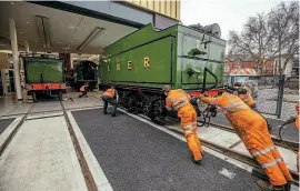  ??  ?? Above: Tender-ly does it: Green Arrow is shifted the last few yards into Doncaster’s new heritage centre. CHARLOTTE GRAHAM