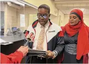  ?? Mark Zaretsky/Hearst Connecticu­t Media file photo ?? Democratic mayoral candidate Shafiq Abdussabur, joined by his wife, Mubarakah Ibrahim, speaks to reporters in the after filing papers in the City Clerk’s Office on Jan. 13, 2022.