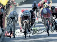  ?? CHRISTOPHE ENA/THE ASSOCIATED PRESS ?? Peter Sagan of Slovakia, left, sprints as Britain’s Mark Cavendish crashes, during the fourth stage of the Tour de France which started in Mondorf-lesBains, Luxembourg, and finished in Vittel, France, Tuesday. World champion Sagan has been disqualifi­ed...