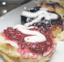  ??  ?? The skimpy flight of sweet biscuits comes with strawberry, blackberry, raspberry and mango jam.