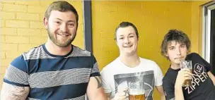  ??  ?? HERE’S CHEERS: Enjoying some beers for Oktoberfes­t are (from left) Mike Oxlong, Michael Roberts and Jordan Harrington.