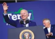  ?? AP PHOTO/ANDREW HARNIK ?? President Joe Biden waves as he arrives to speak at a campaign event for Virginia democratic gubernator­ial candidate Terry McAuliffe, right, at Lubber Run Park on Fridayin Arlington, Va.