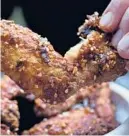  ?? ?? Korean fried chicken marries sweet and spicy, for “swicy,” in New York. KARSTEN MORAN/ THE NEW YORK TIMES 2016