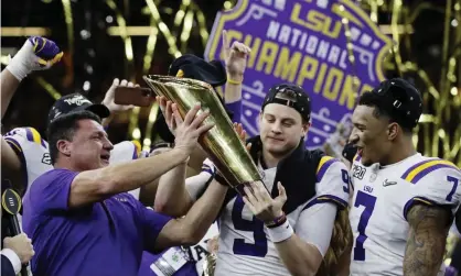  ??  ?? Ed Orgeron, left, Joe Burrow and Grant Delpit, right, celebrate LSU’s title win. Photograph: Sue Ogrocki/AP