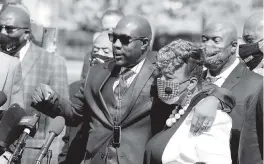  ?? JIM MONE AP ?? Philonise Floyd, left, the brother of George Floyd, with Gwen Carr, the mother of Eric Garner, during a news conference and prayer vigil outside the Hennepin County Government Center during lunch break Tuesday.