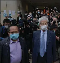  ?? (AP/Kin Cheung) ?? Pro-democracy activists Martin Lee (right) and Albert Ho (left) arrive for court Friday in Hong Kong to be sentenced for their role in organizing a 2019 anti-government march.