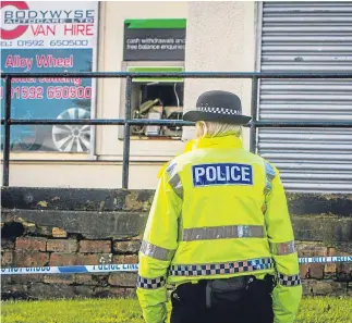  ?? Pictures: Steve Macdougall. ?? Left: police at the scene in Pentland Place, Kirkcaldy, with the smashed-up cash machine in the background. Right: the remains of the ATM, though it is not yet certain the thieves got away with any cash.