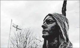  ?? KEVIN SULLIVAN/THE WASHINGTON POST ?? A statue of Pocahontas stands in Gravesend, England, where she is buried. Her real name is Matoaka. Pocahontas was a nickname, of sorts, often translated as “playful one.”