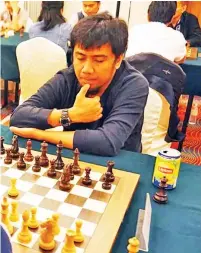  ?? GILBERT CASTRO PASCUA FB ?? GOOD START. Davao City’s internatio­nal master (IM) Oliver Dimakiling, shown here during the recent Borneo Chess Festival, eyes his third GM norm in Abu Dhabi.