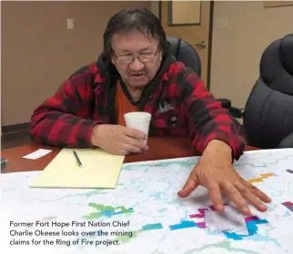  ??  ?? Former Fort Hope First Nation Chief Charlie Okeese looks over the mining claims for the Ring of Fire project.
