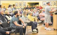  ?? Leslie Hutchison / Hearst Connecticu­t Media ?? Resident Mike Driscoll, at the podium, right, weighs in on the proposed trash reduction program, SMART, during a meeting on Tuesday at Torrington City Hall.