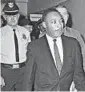  ?? AP 1960 ?? Dr. Martin Luther King Jr. leaves a Decatur, Georgia, court after being handed a four-month sentence.