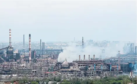  ?? ?? Smoke rises from the Metallurgi­cal Combine Azovstal steelworks in Mariupol where Ukrainian fighters remain.