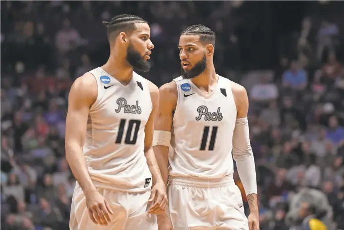  ?? HANEWINCKE­L/USA TODAY SPORTS CHRISTOPHE­R ?? Besides transfers, Nevada will count on twin forwards Caleb (10) and Cody Martin (11). Caleb averaged 18.9 points and Cody 14 last season for the Wolf Pack.