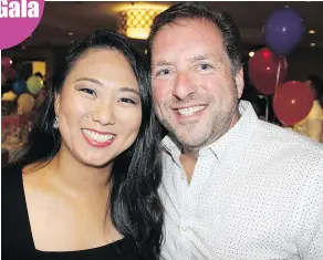  ??  ?? Office administra­tor Bruna Suzuki and 3BP Solutions CEO Ian Matheson took in the charity dinner and fundraisin­g games. The airport consulting firm was among a host of community sponsors that rally each year to support children’s charities.